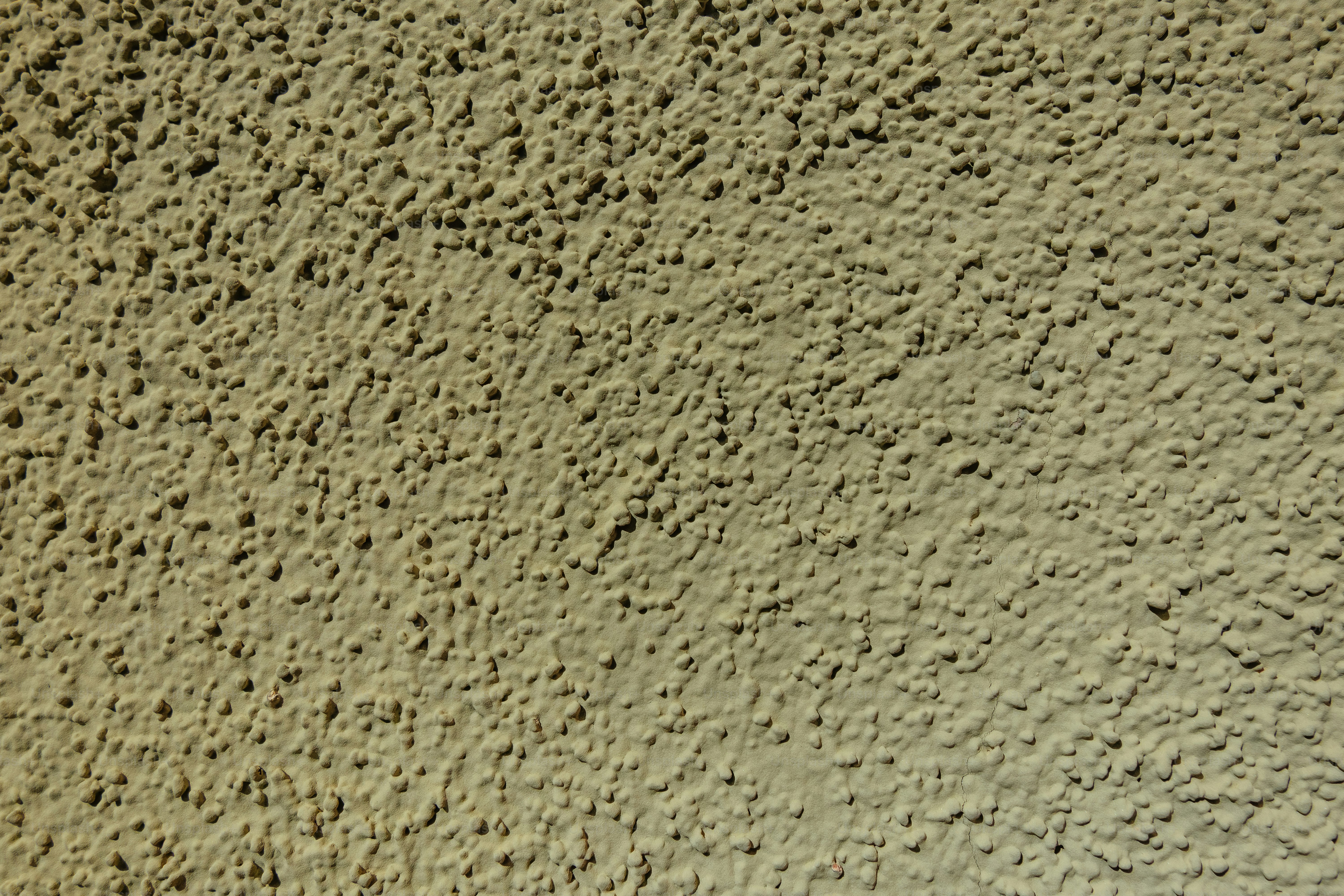 um close up de uma parede feita de cimento