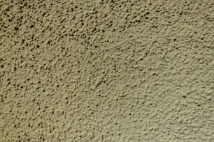 a close up of a wall made of cement