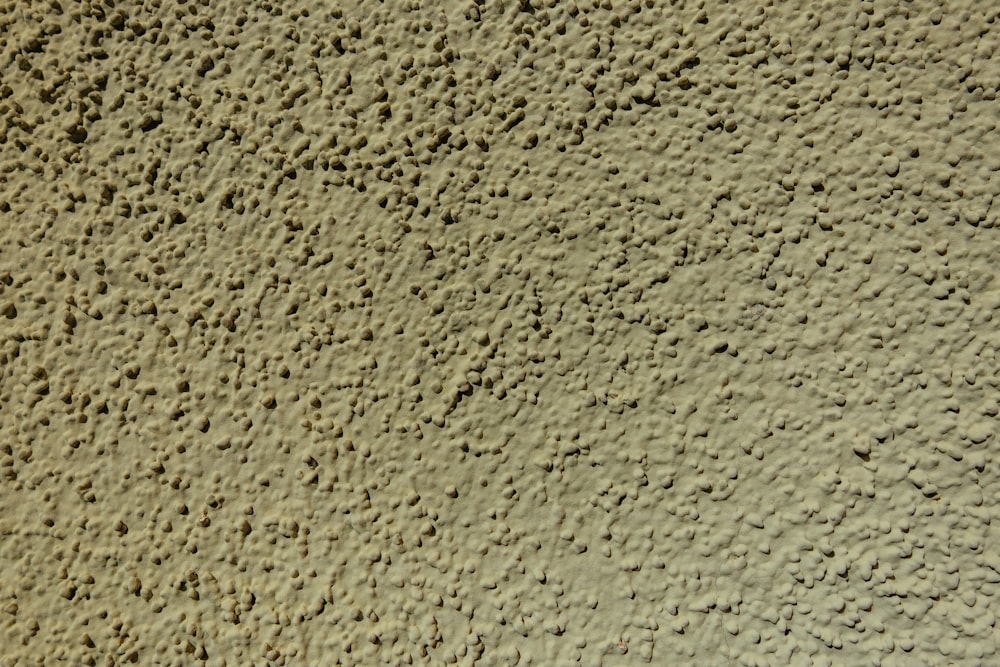 a close up of a wall made of cement