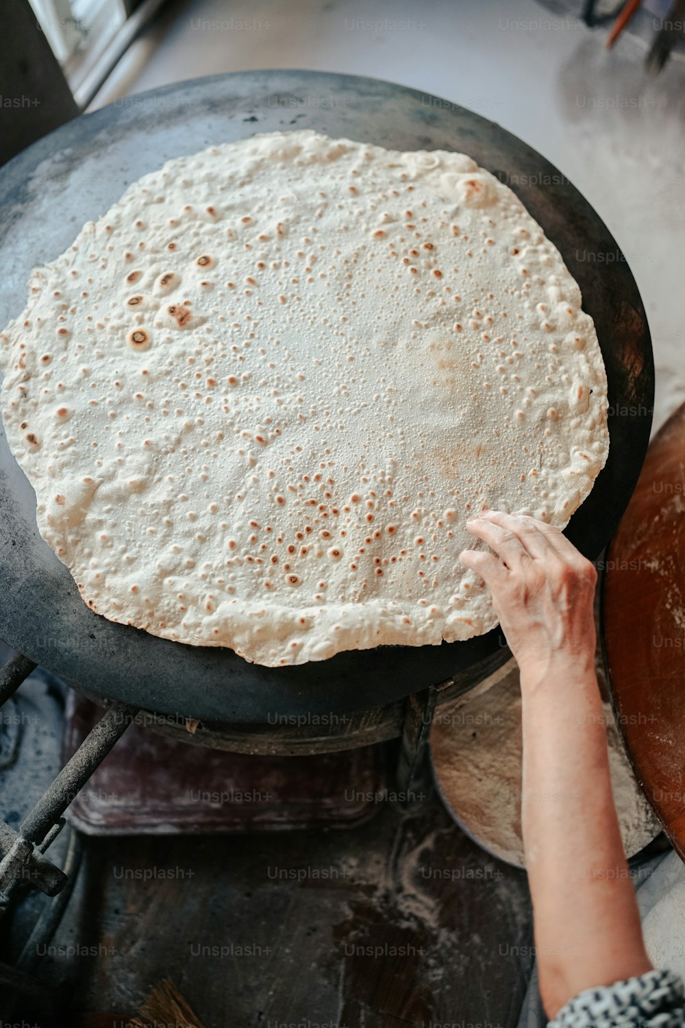 a person is making a pizza in a pan