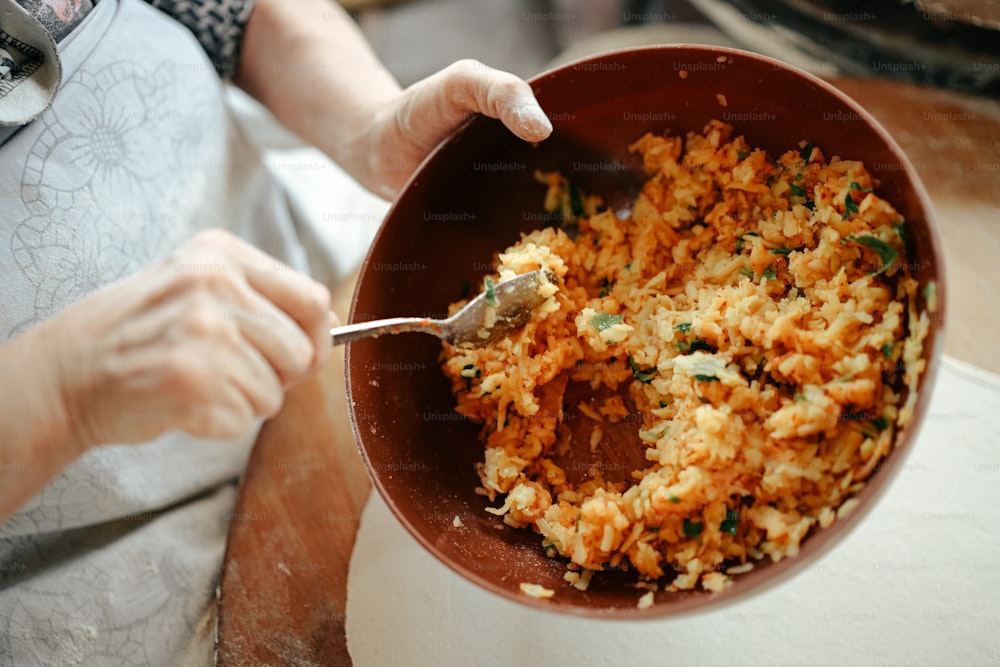 a bowl of rice with a spoon in it