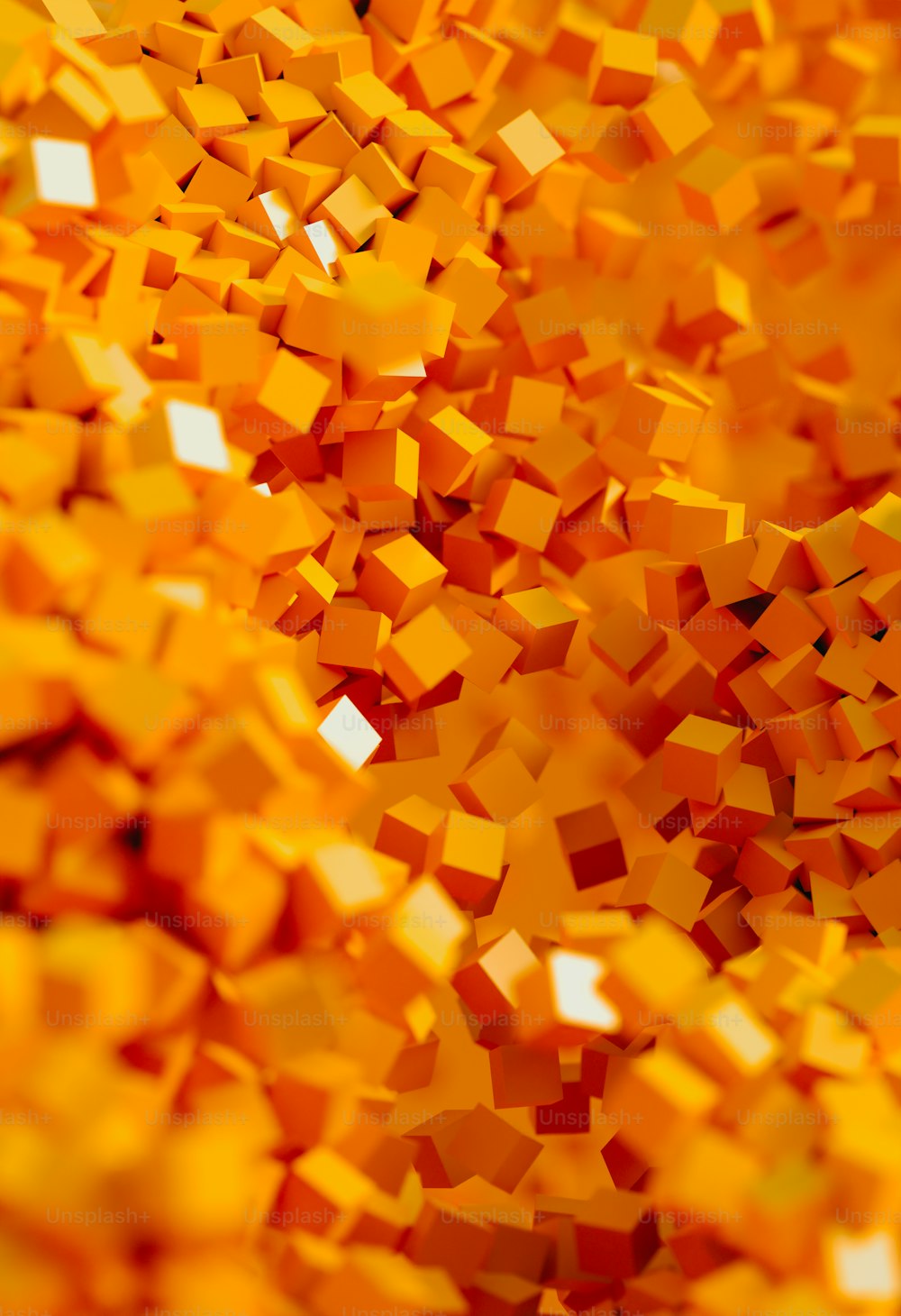 a large pile of orange cubes on a white surface