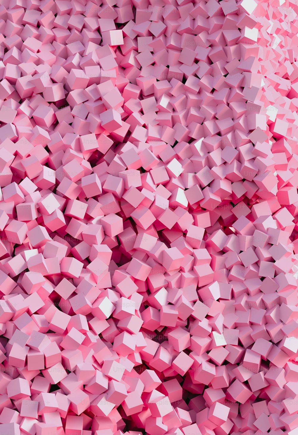 a large pile of pink cubes in the middle of a room