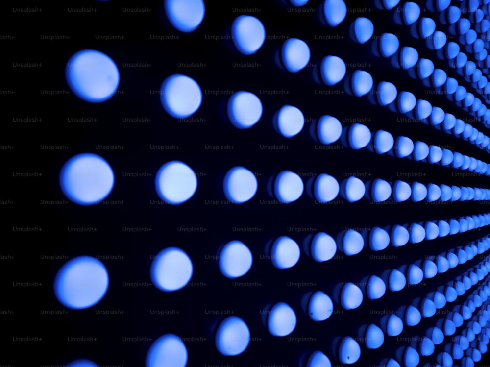 a close up of a wall with blue circles on it