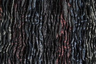 Gros plan d’un matériau texturé noir et rouge