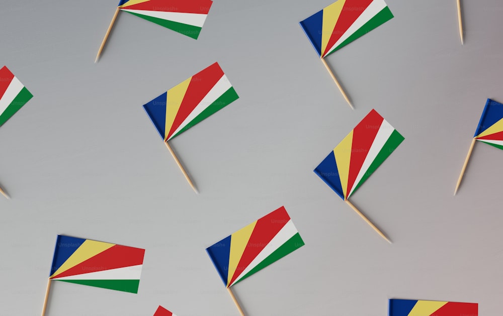 a bunch of flags that are on a stick