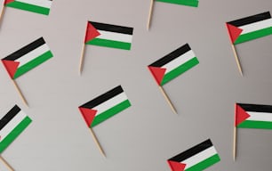 a bunch of flags that are on a stick