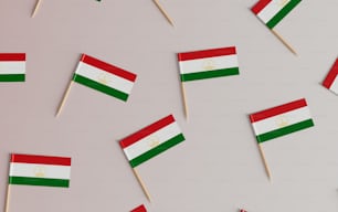 a group of small flags on toothpicks on a table