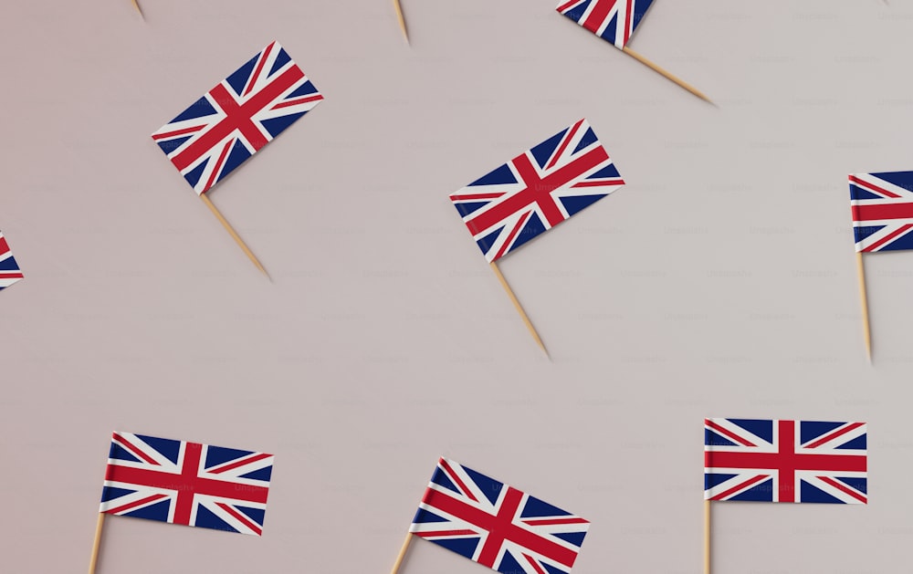 a group of small british flags on toothpicks