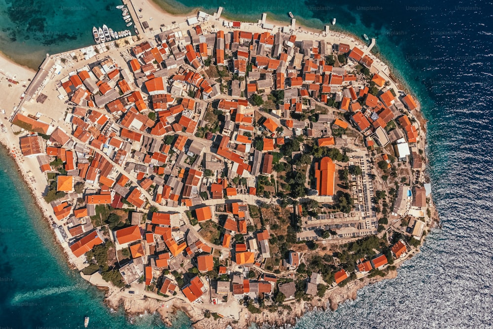 an aerial view of a small island in the middle of the ocean