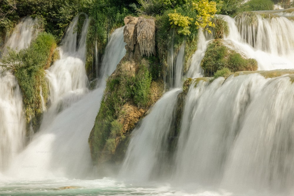 a large waterfall with lots of water cascading