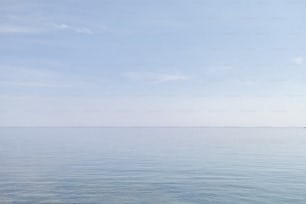 a boat floating on top of a large body of water