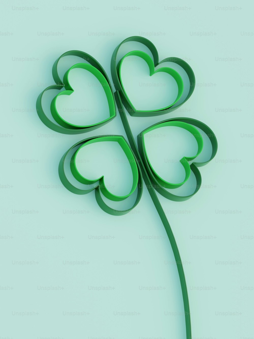 a four leaf clover with a light blue background