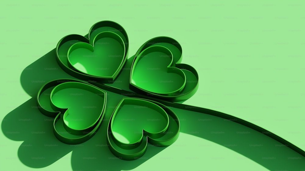 a four leaf clover shaped object on a green background