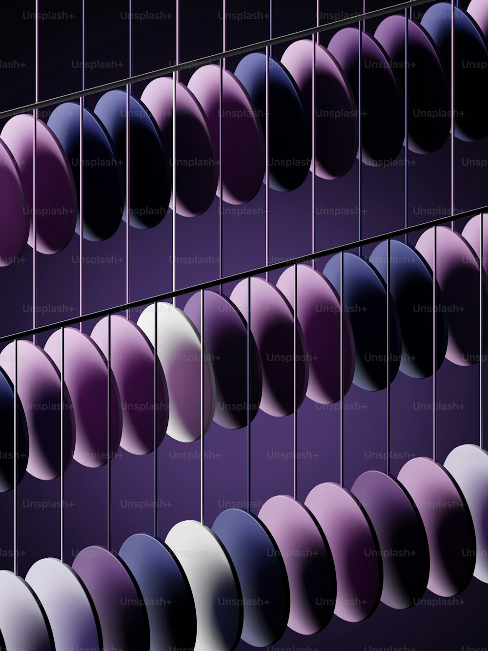 a bunch of balls hanging from a purple wall