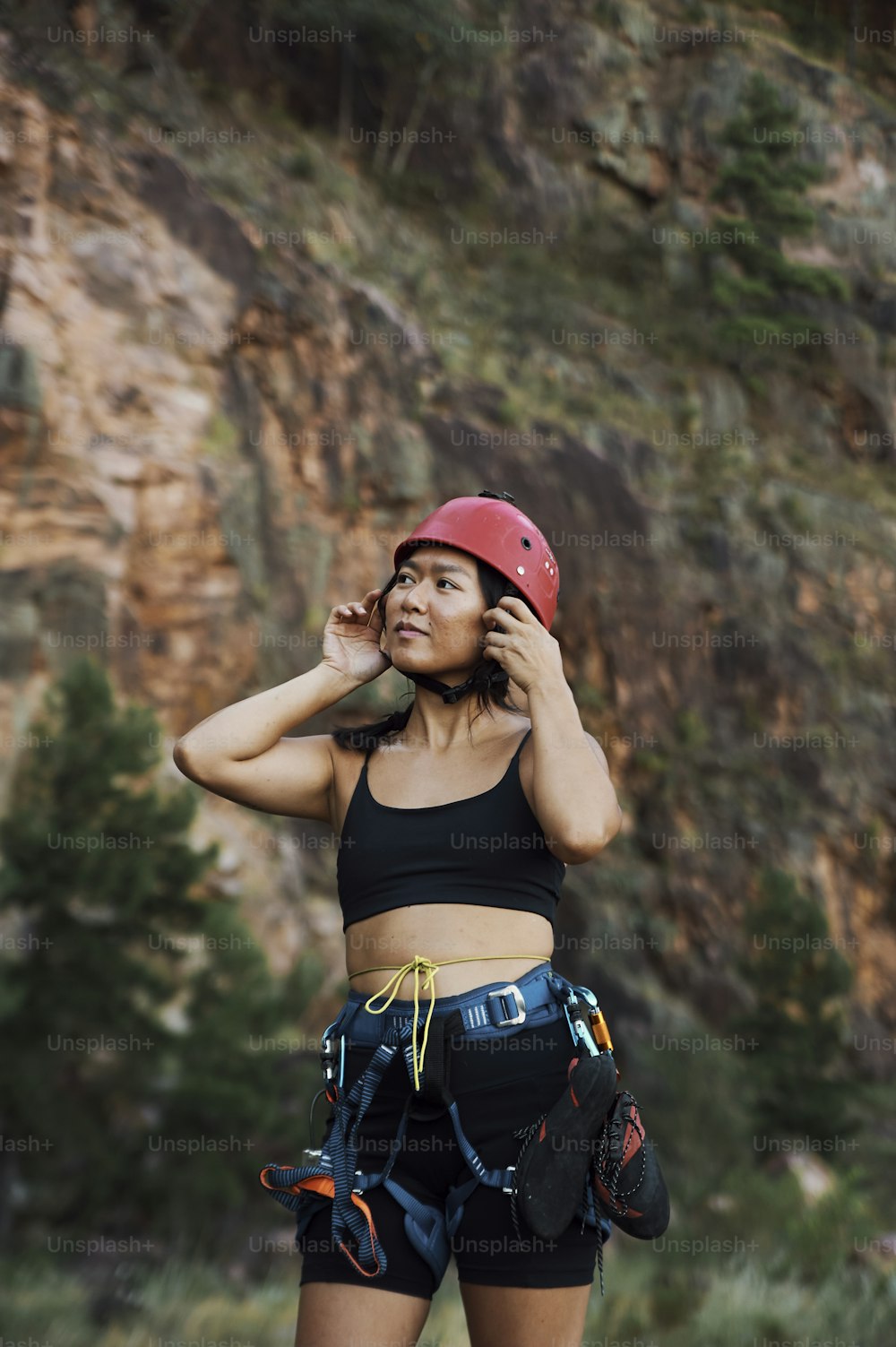 a woman wearing a helmet talking on a cell phone