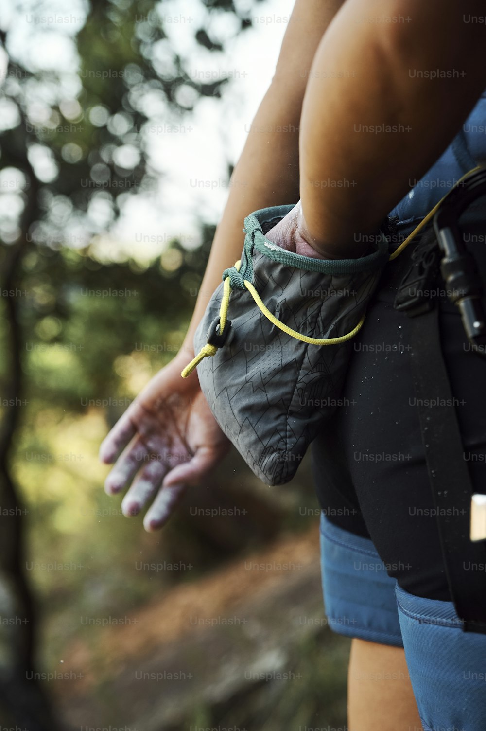 a close up of a person holding a bag