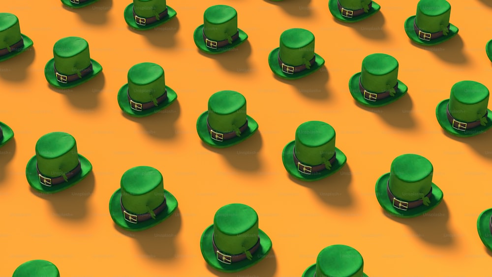 a group of green hats on a yellow background