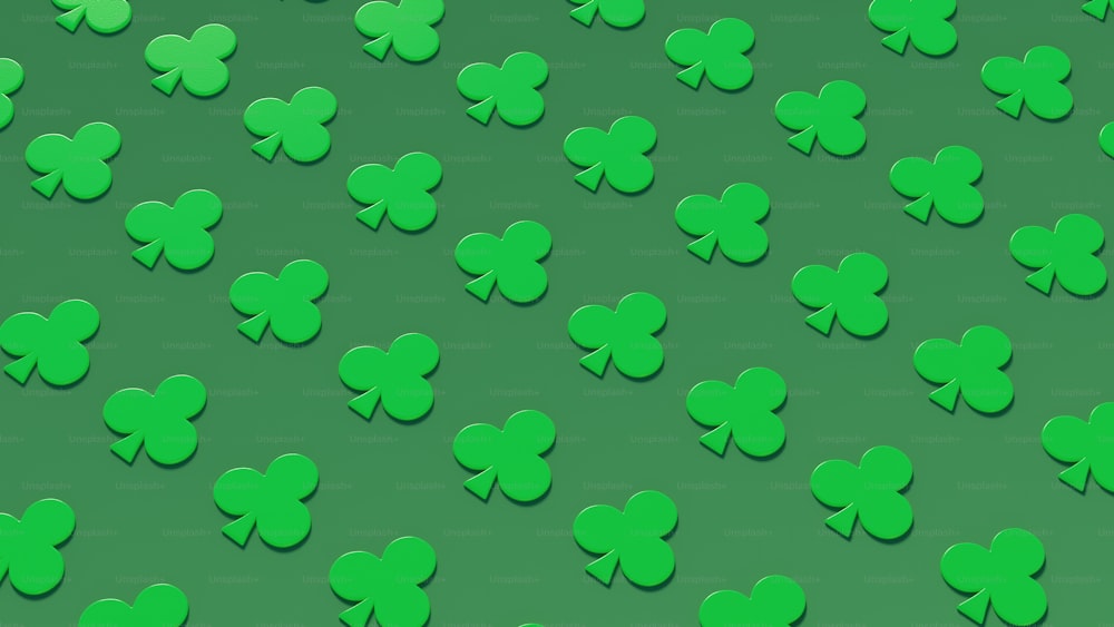 a lot of green shamrocks on a green background