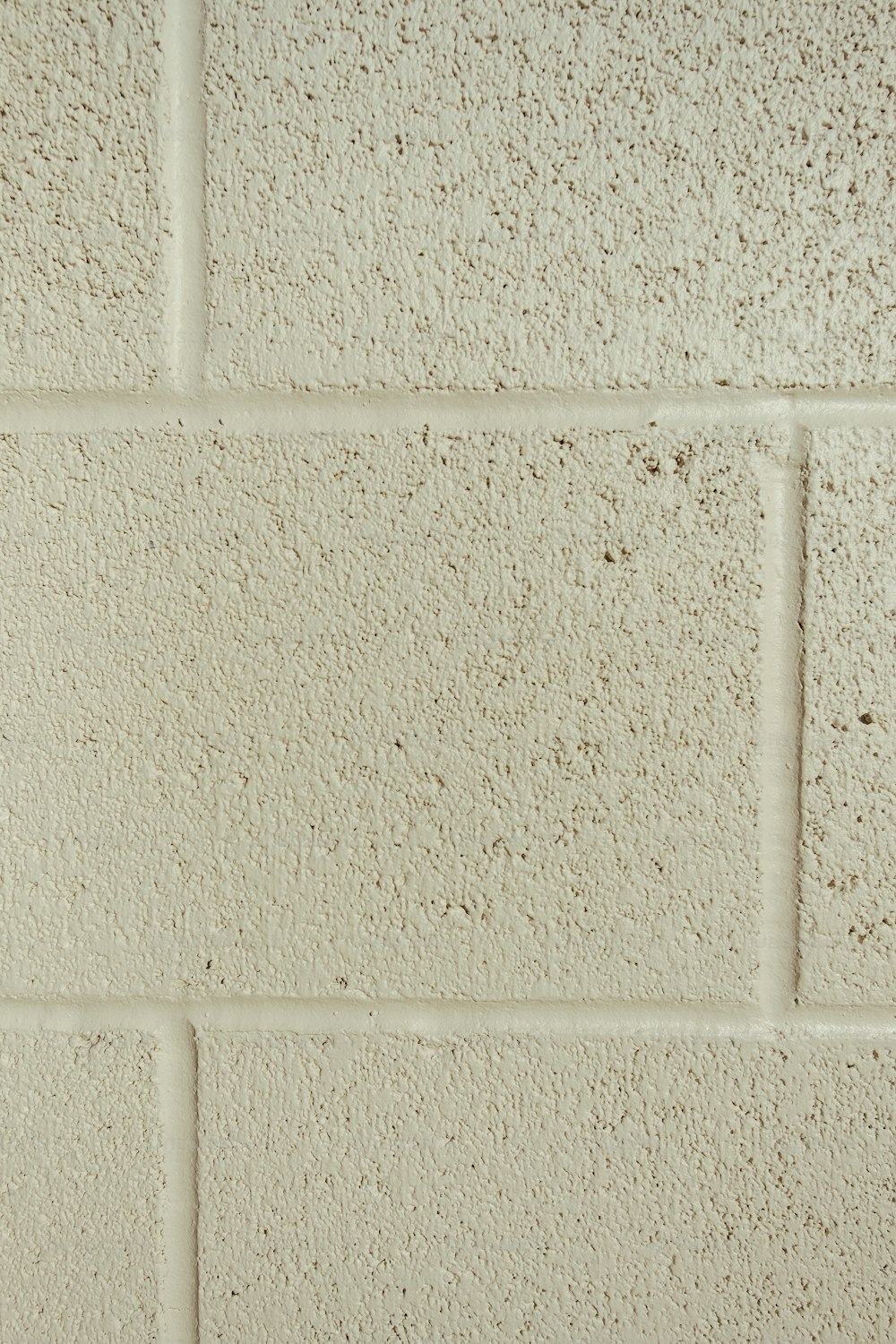 a close up of a white brick wall