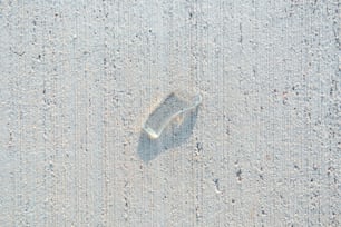 a small umbrella sitting on top of a sandy beach