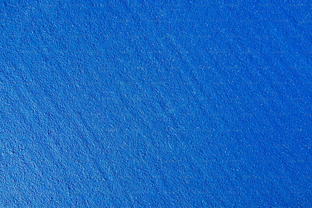 an airplane flying over a bright blue sky