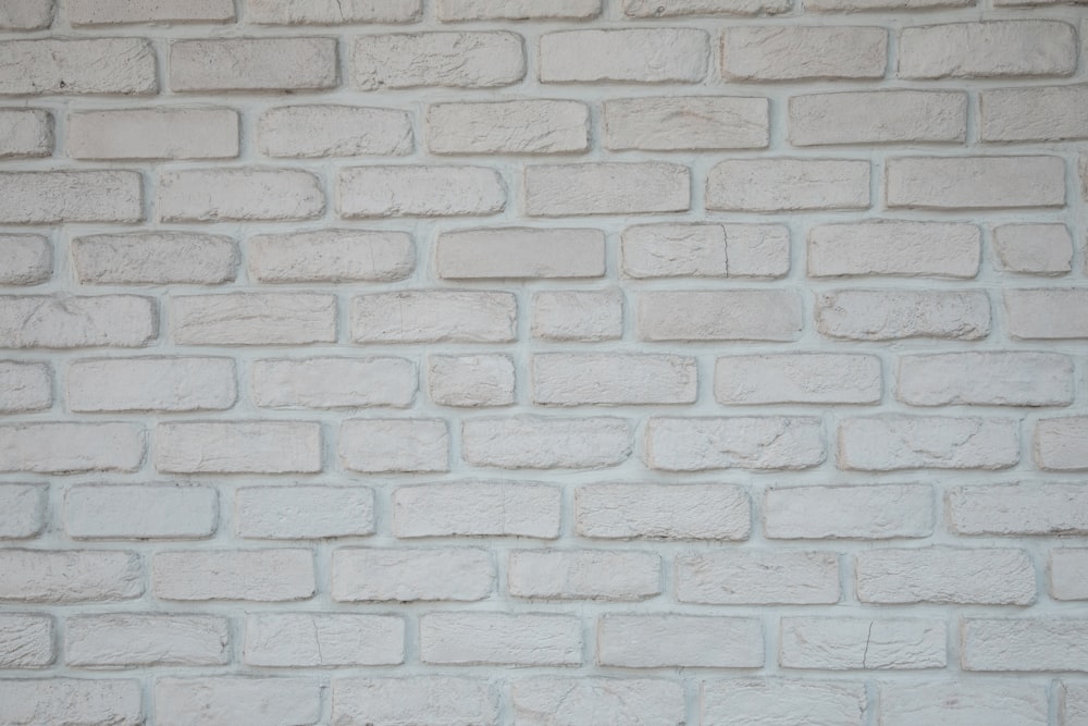 a close up of a white brick wall