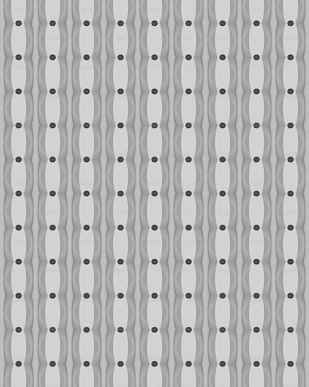 a gray and black pattern with circles on it