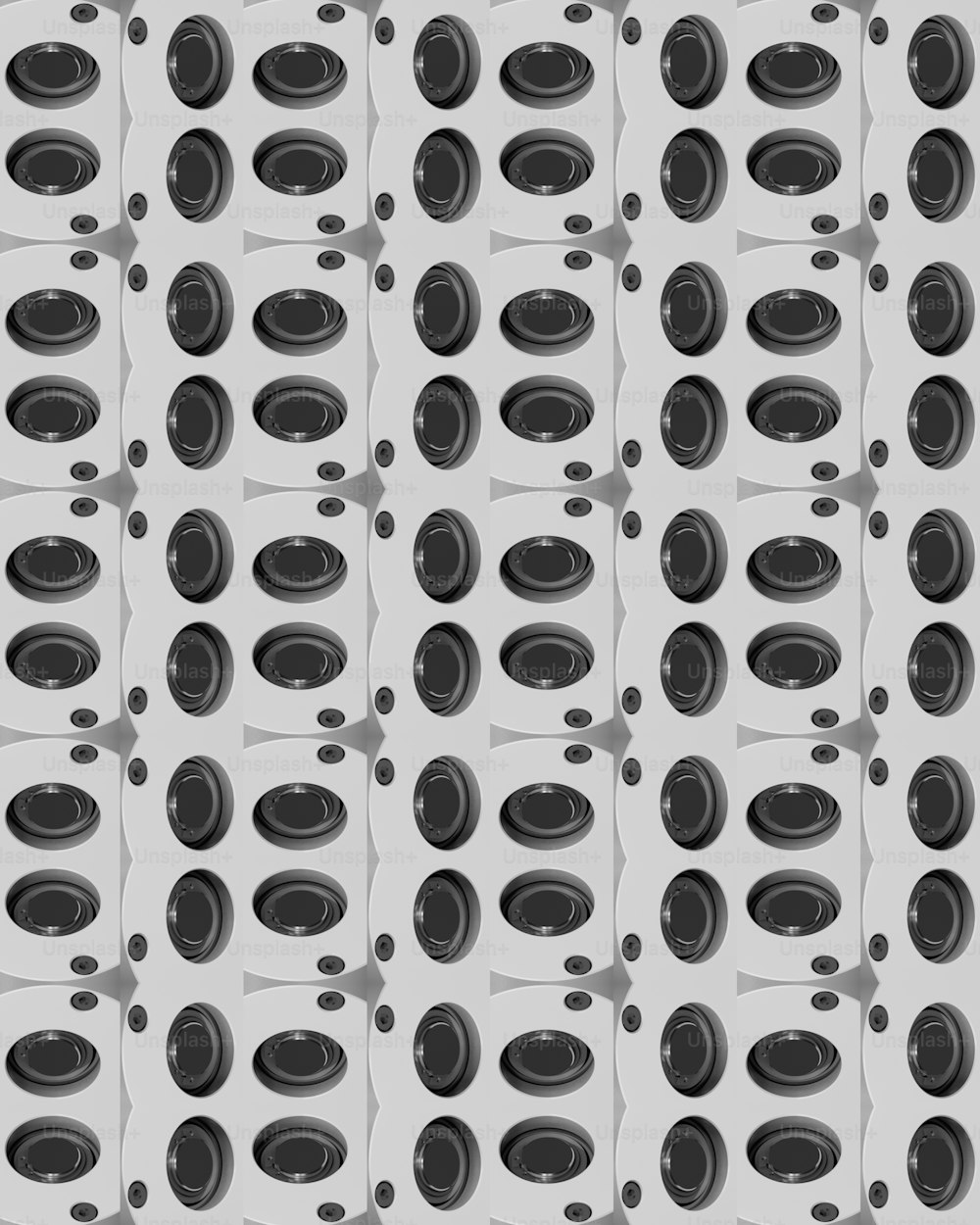 a black and white pattern with circles and dots