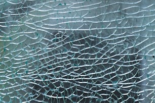 a close up of a broken glass window