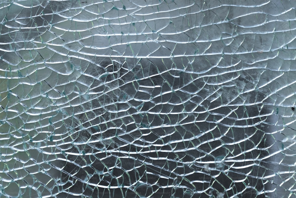 a close up of a broken glass window