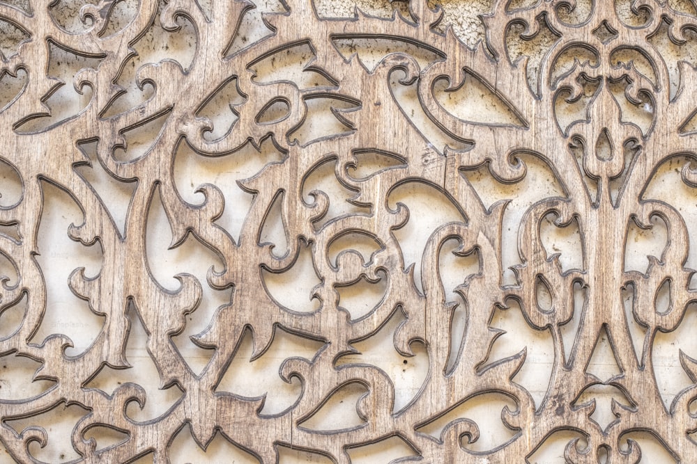 a close up of a wood carving on a wall