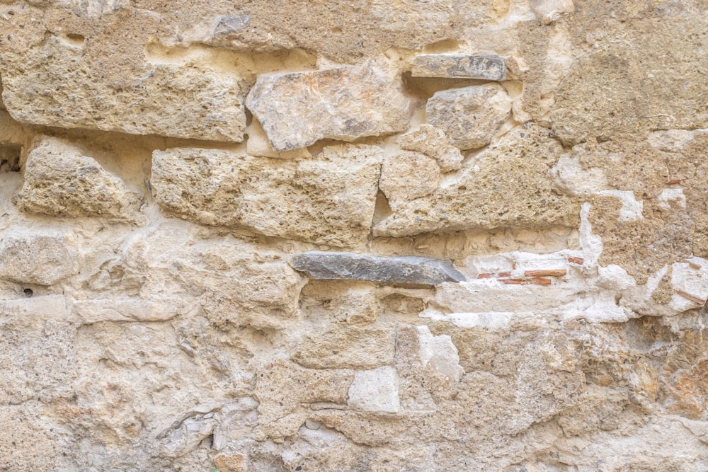 a stone wall with a knife sticking out of it