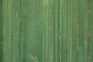 a close up of a green metal surface