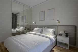 a bedroom with a large bed and a mirrored wall