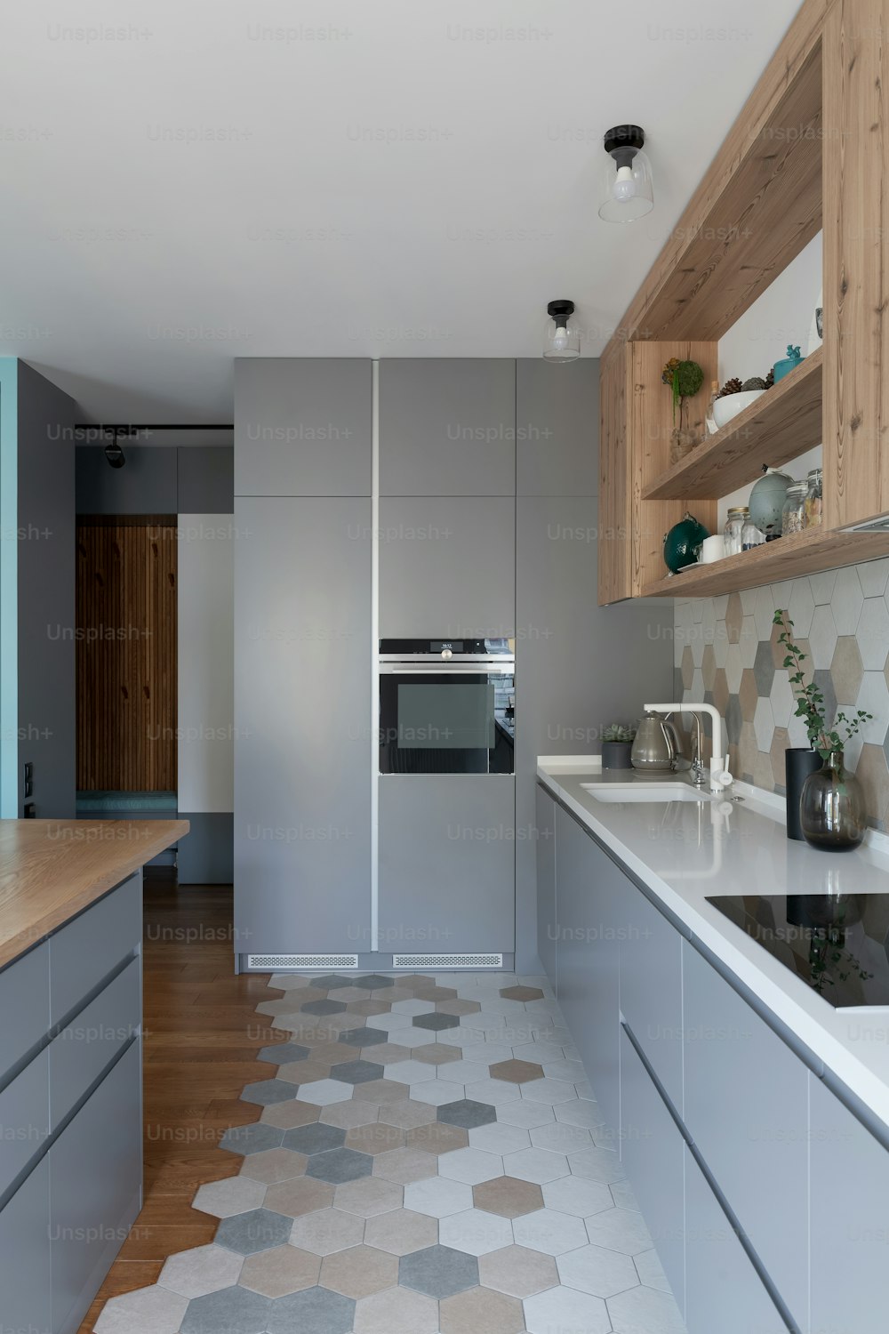 a kitchen with a stove top oven next to a sink