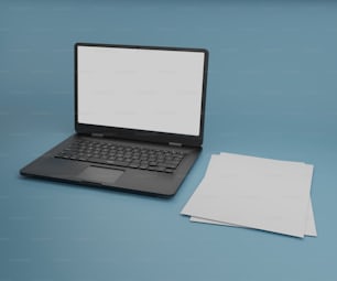 um computador portátil sentado em cima de uma mesa azul