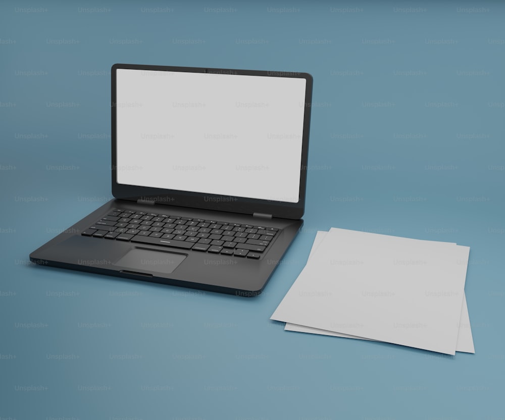 a laptop computer sitting on top of a blue table