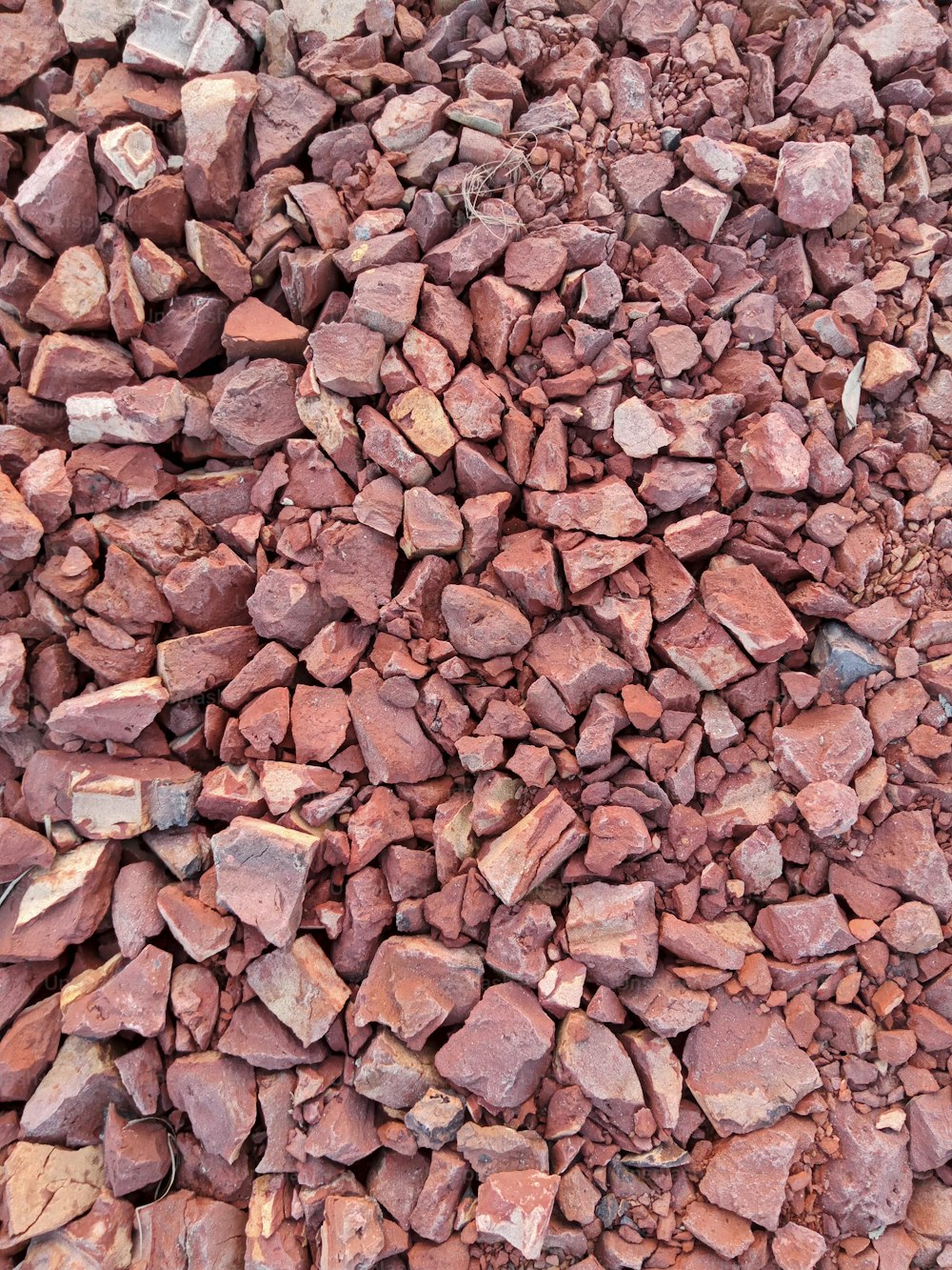 a pile of red rocks sitting next to each other