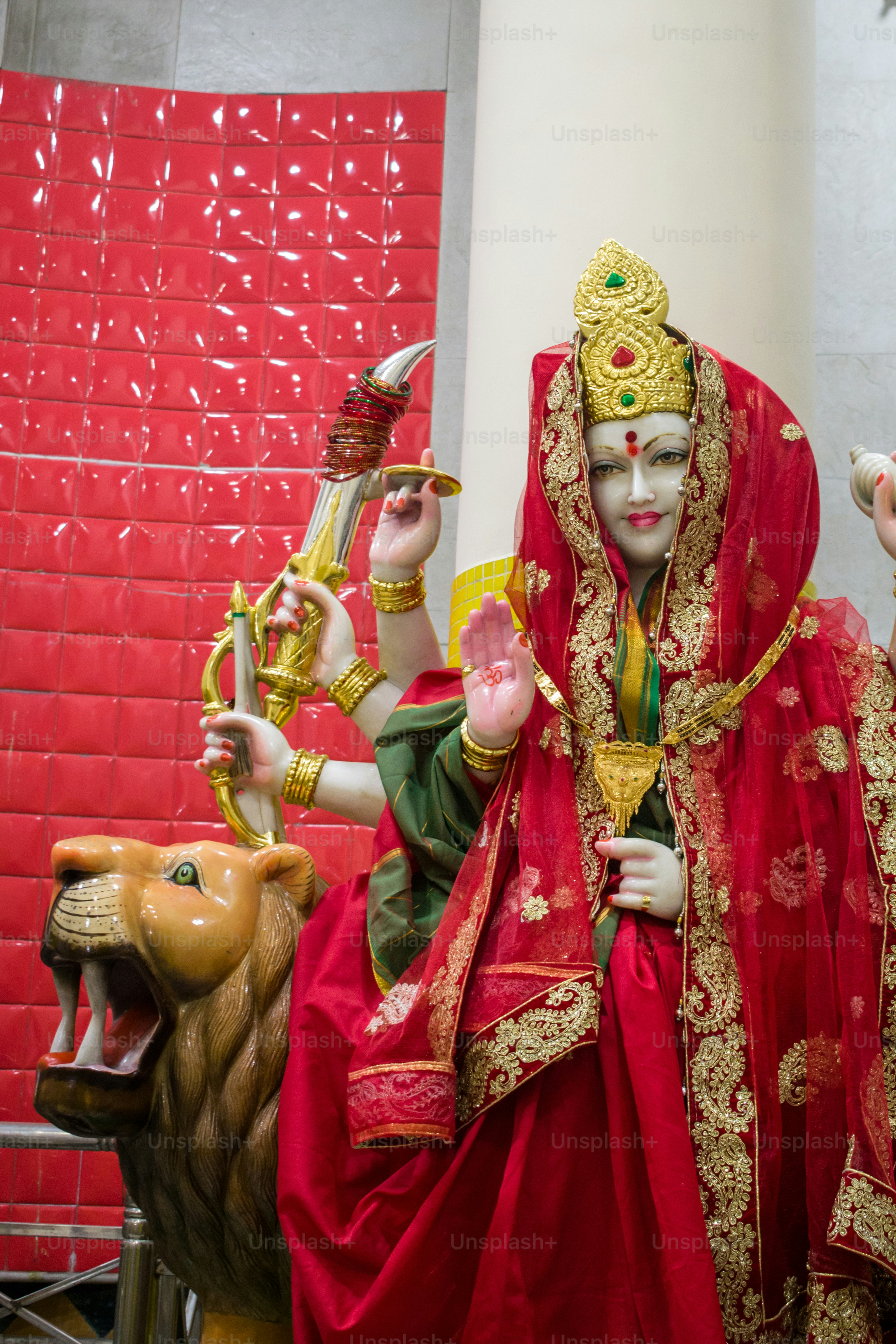 a statue of a woman in a red dress