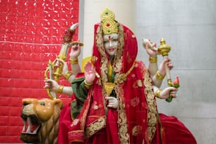 a statue of a woman in a red dress