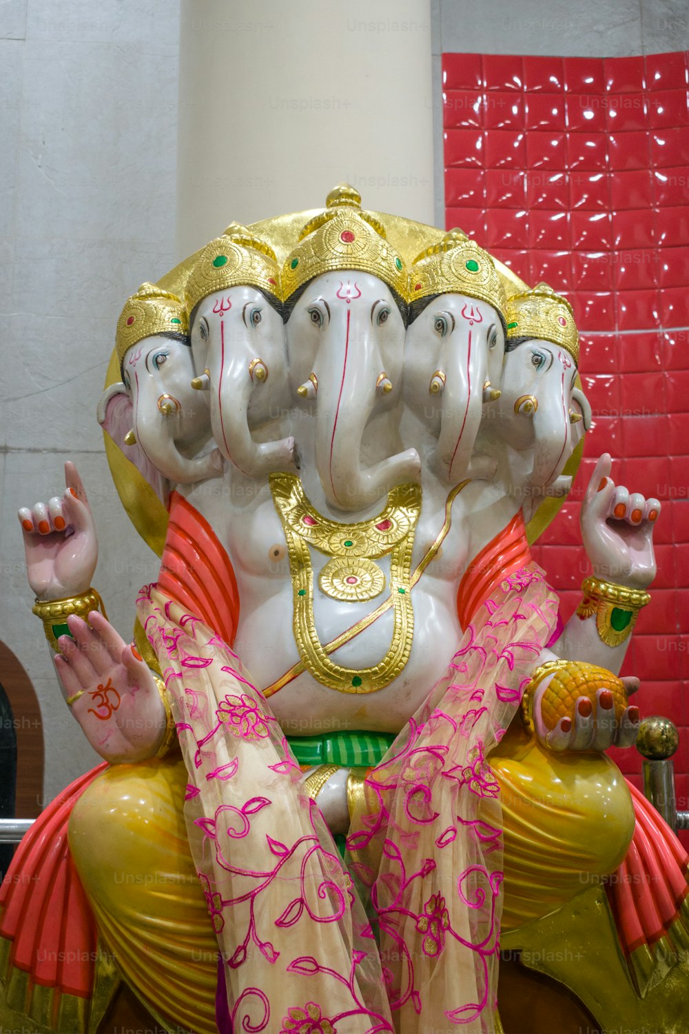 a statue of an elephant sitting on top of a table