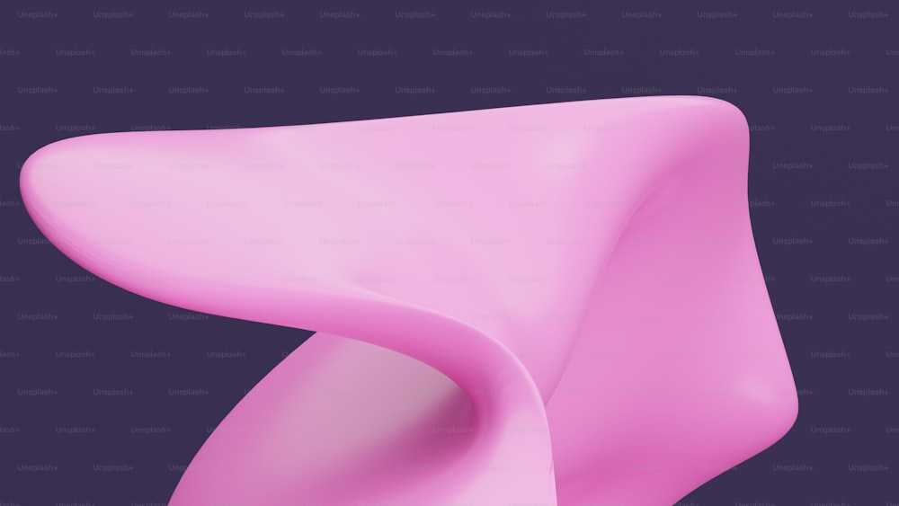 Un primer plano de un objeto rosa sobre un fondo púrpura