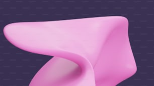 a close up of a pink object on a purple background