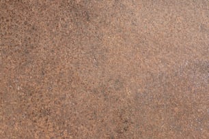 Gros plan d’une surface de pierre brune