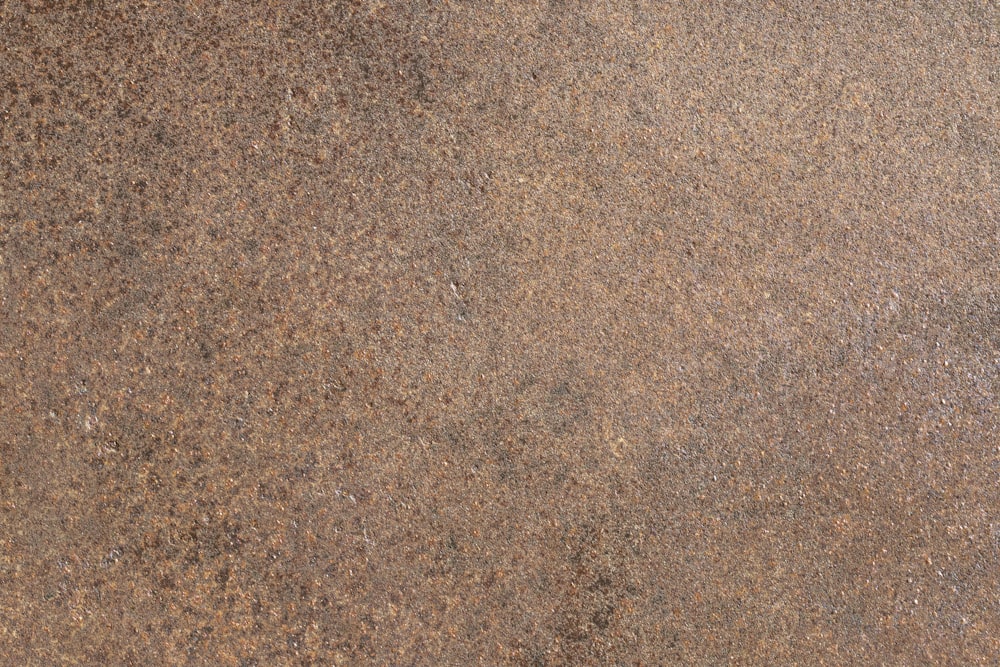 a close up of a brown stone surface