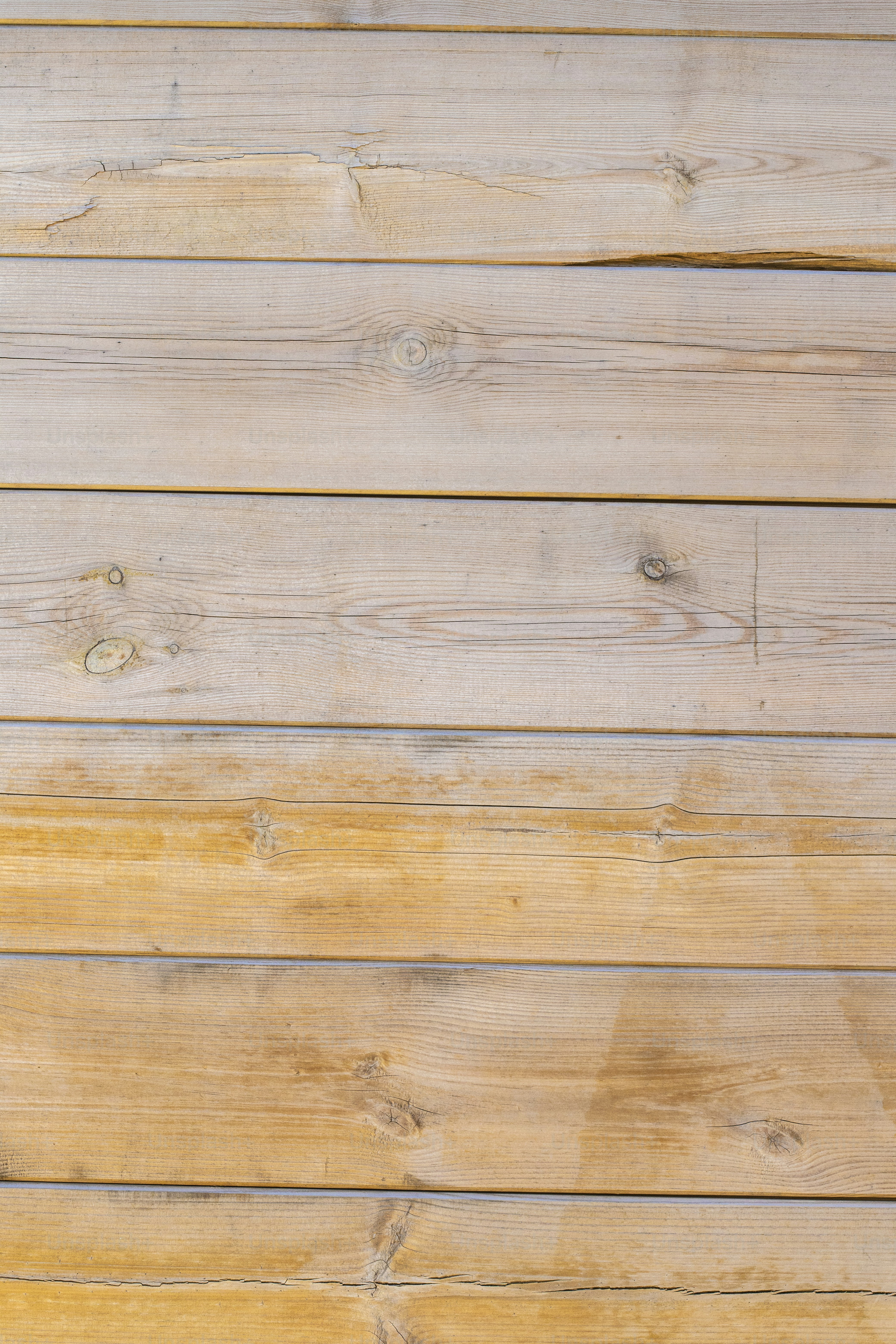 a close up of a wooden wall with a clock on it
