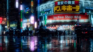 a group of people walking down a street at night