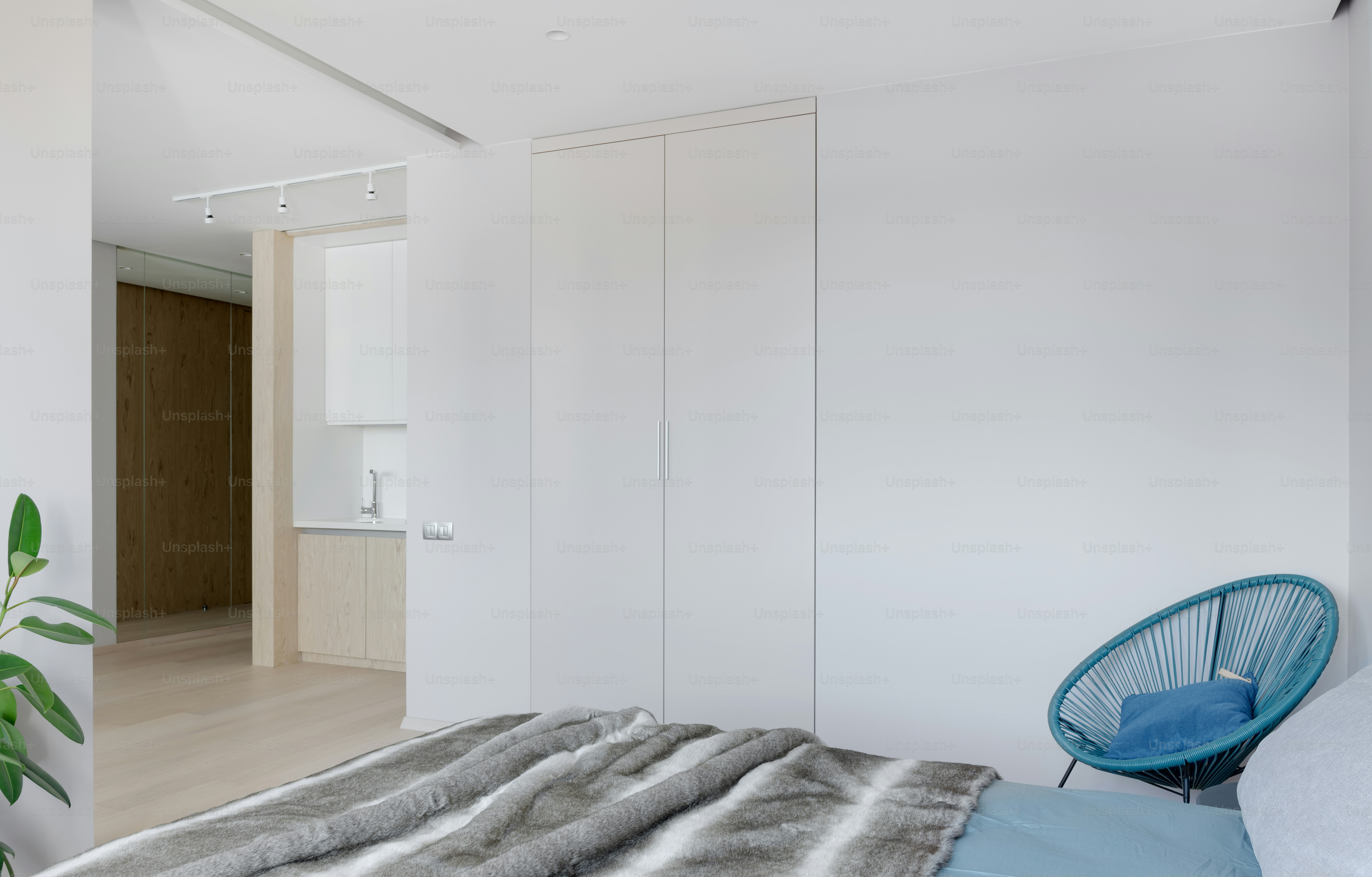 a bedroom with a bed and a chair