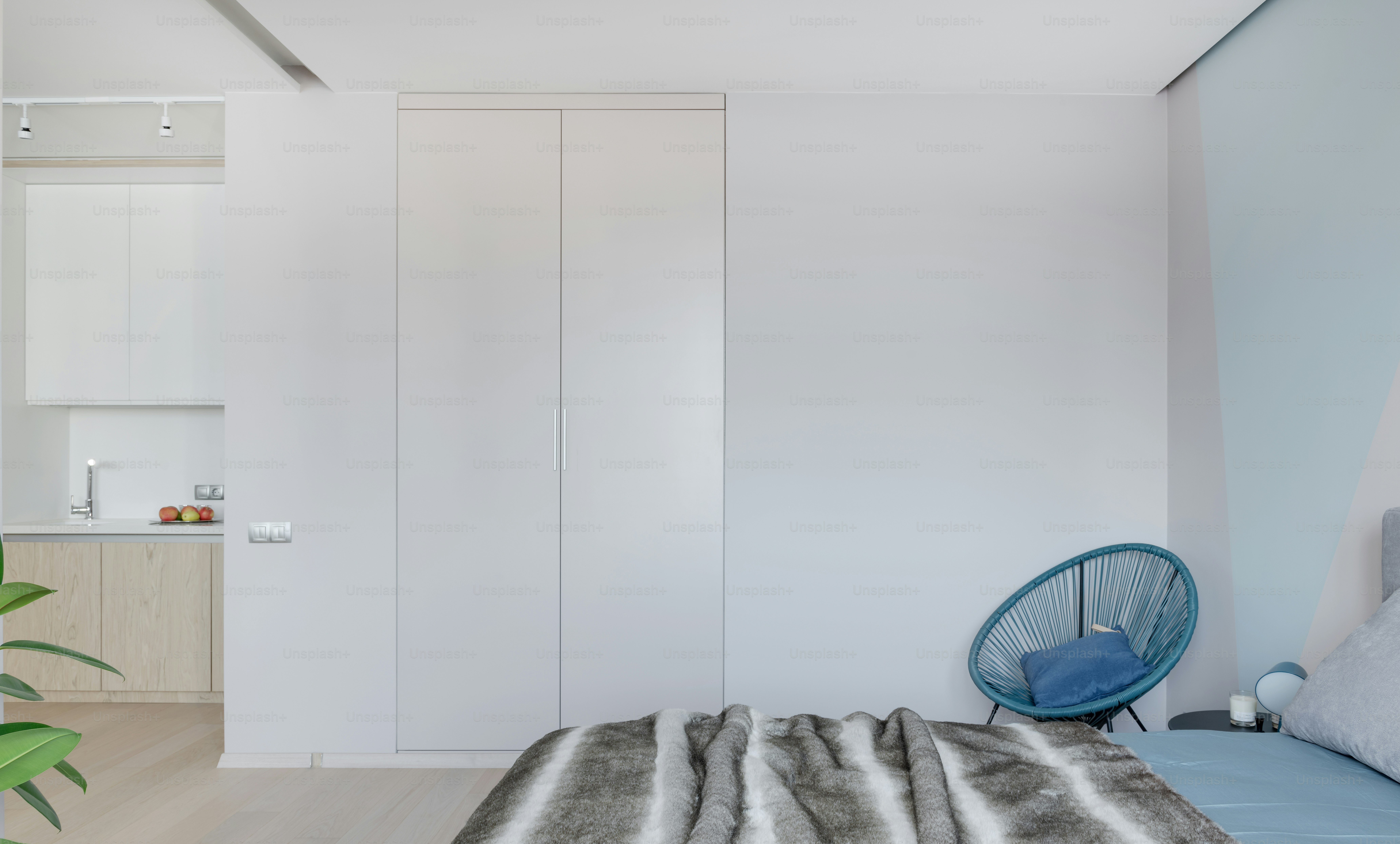 a bedroom with a bed and a chair